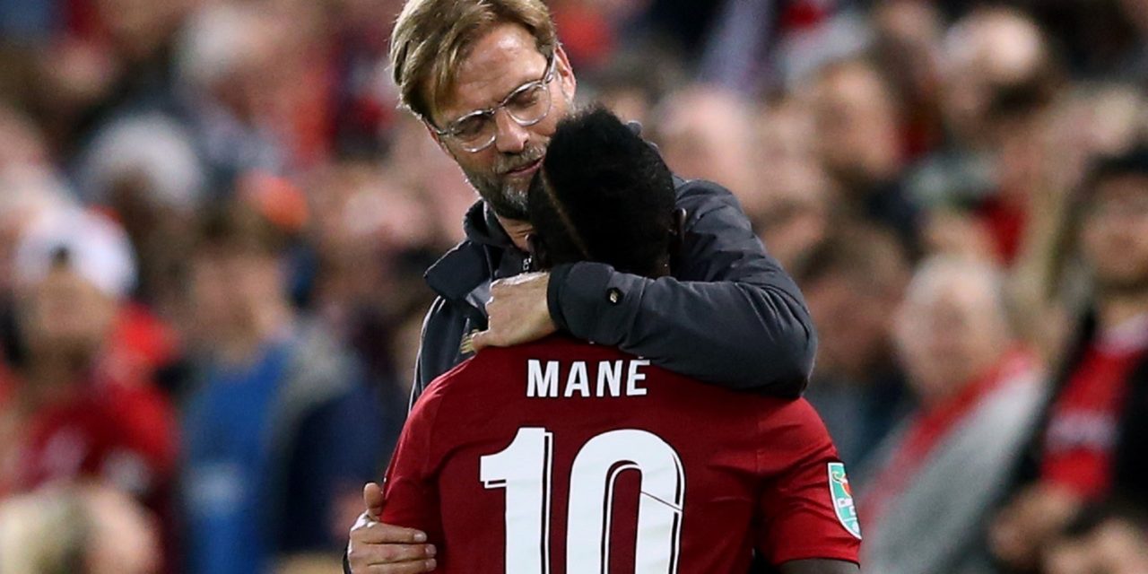 LIVERPOOL, ENGLAND - SEPTEMBER 26:  Sadio Mane of Liverpool is embraced by Jurgen Klopp, Manager of Liverpool during the Carabao Cup Third Round match between Liverpool and Chelsea at Anfield on September 26, 2018 in Liverpool, England.  (Photo by Jan Kruger/Getty Images)