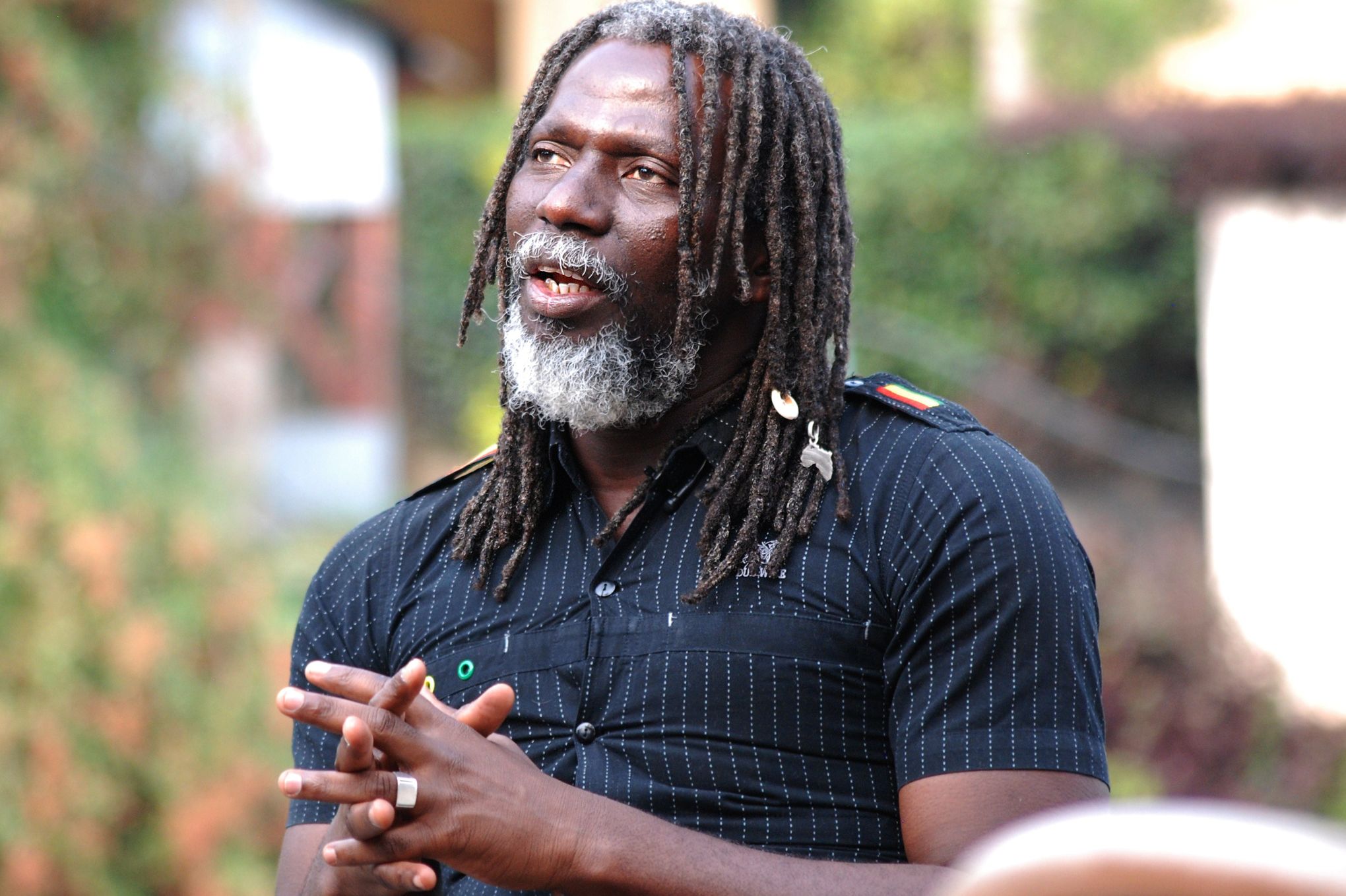 (FILES)-- A file photo taken on February 14, 2015 shows Ivorian reggae artist Moussa Doumbia, known as Tiken Jah Fakoly, speaking during an interview in Goma. Fakoly was turned back upon his arrival at the airport of Kinshasa on June 19, 2015, where he was supposed to give a concert on June 21 at the Jazz Kif 2015 festival. According to an organizer of cultural events in Kinshasa and a diplomatic source, it has become extremely difficult to bring artists into the country since March 15, when about thirty people, including rappers and civil society activists, were arrested during a meeting on good governance in Africa. AFP PHOTO / FLORY MUMENA
